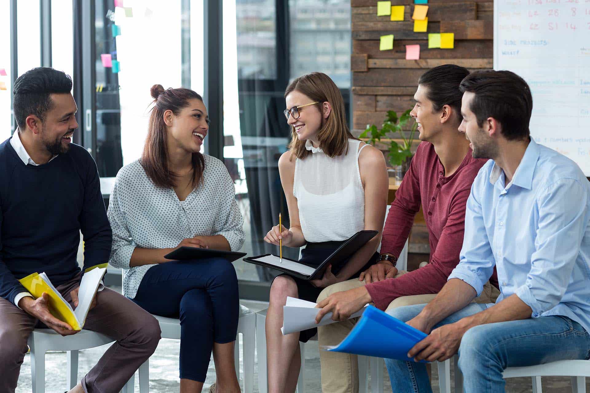 group of IT professionals talking during meeting